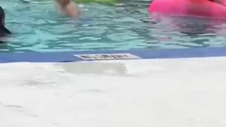 Woman shaving her legs at a swimming pool