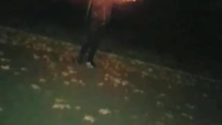 Man holds firework to mouth and lets go