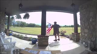 UPS Driver Stops to Fix Flag