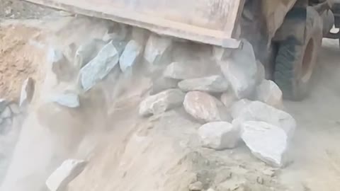 A satisfied video working in rural area road construction