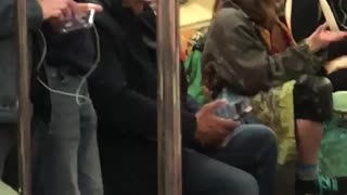 Girl with skateboard dancing with hands subway sitting down