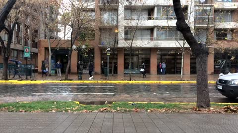 People Walking On Streets On Rainy Weather