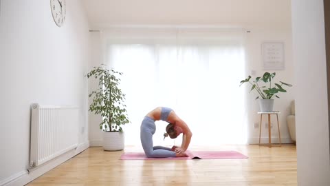 Expert demonstrates advanced back-bending yoga move