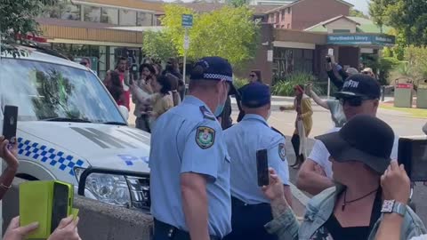 Australia: Protesters Surround Police. Police throw Protester in Van