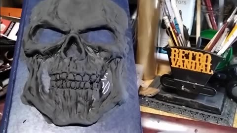 Sculpting a skull on an old Grays Anatomy book with Poly-Props Ltd Craft Foam Clay