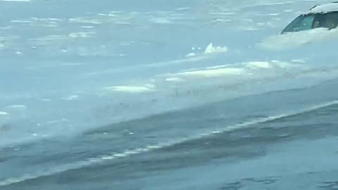 Car Stuck in Deep Snow after Blizzard