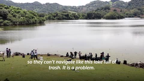 El Salvador's biggest lake is swamped by trash