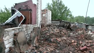 Retaken Donetsk town residents show destroyed homes