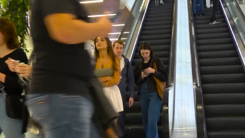 A very naughty girl on the escalator prank - Touching Hands On Escalator