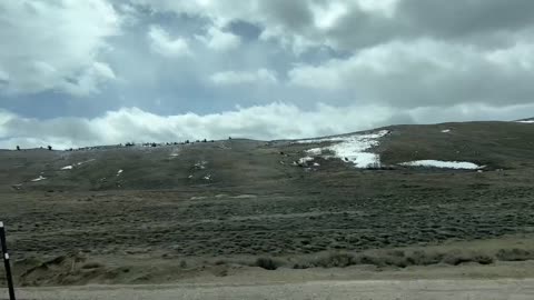 Roadside Wyoming, over the Snowy Mountains