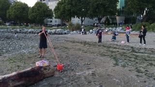 Bubble artist dazzles crowd with massive rainbow doughnut