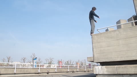 Free Runner Back Flips off High Ledge