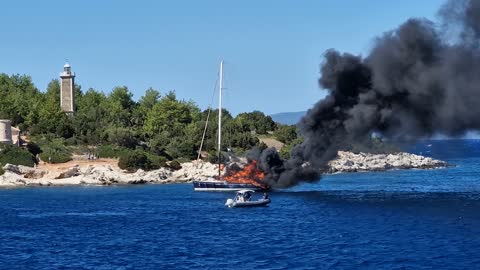 Yacht Burns on the Water