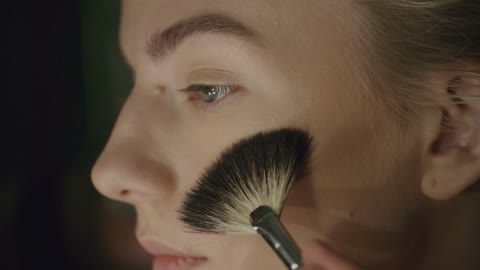 Girl doing makeup for the eyes