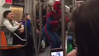 Spiderman costume guy does flips and dances in subway