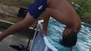 Slo-mo video boy front flips into pop-up pool