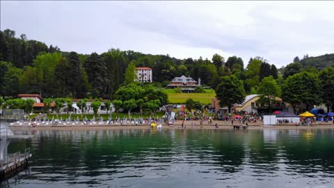 aerial view on the beach lake orta before beginning swimming race in italy