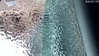 Storm Leaves Ice Sheet in Place Over Window