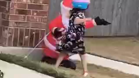 child beating Santa Claus