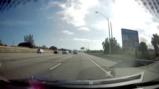 Driver Deftly Dodges Fallen Ladder on Freeway