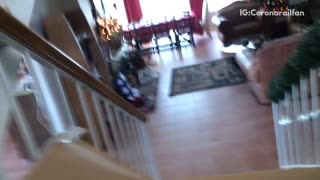 Pov kid slides down carpeted stairs in cardboard box