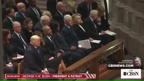 Trumps arrive at George HW Bush funeral, greet Obamas