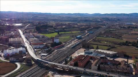train passing the city of catalayud spain aerial view sunny day railway station