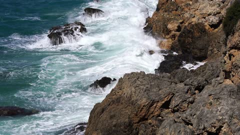 Waves Crashing To The Rocks