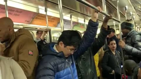 Guys sing and clap we will rock you by queen on subway train