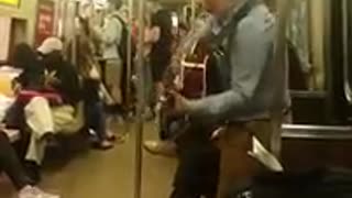 Guy named Shane playing guitar on the R train in Manhattan