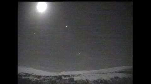 Meteor next to the moon