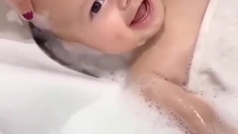 Baby is having so much fun during her shower time