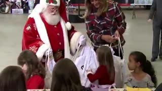 Melania Trump handing out toys at Toys for Tots event