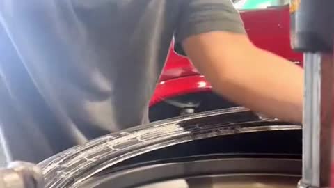 The mechanic fitted the tyre expertly
