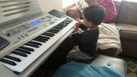 2-year-old boy rocks out to Hero from a MIDI keyboard