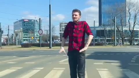 a man stops at the light and takes a little step top