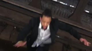Drunk man walks across subway train tracks onto platform at 3am