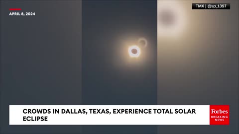 The Total Solar Eclipse Is Viewed By Crowds In Dallas, Texas