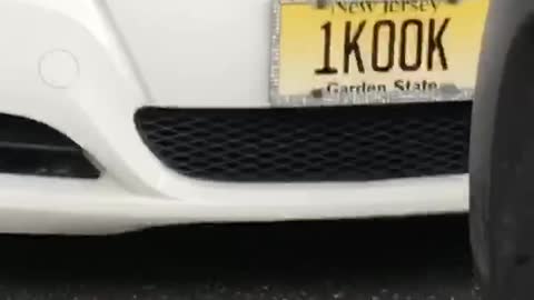 1kook yellow license plate on white car