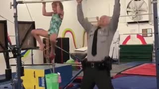 7-year-old gymnast challenges state trooper to pull-up challenge