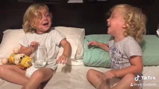 Young Twins Argue Over Who Spilled The Water
