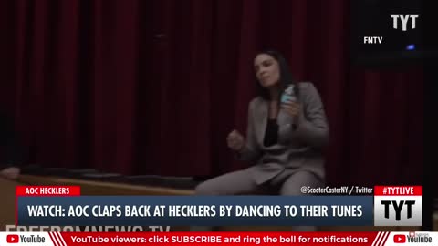 AOC dances while at town Hall meeting while people protest