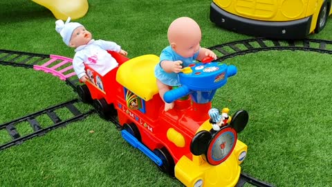 Babies Ride on Train at the Playground