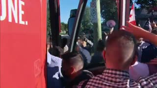 An angry crowd shouts at Trudeau and someone throws gravel at him in London, ON
