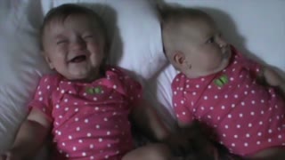 Funny Baby Makes Her Twin Sister Laugh