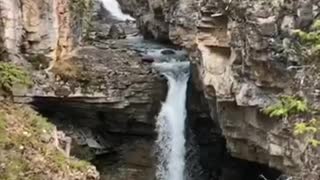 Double backflip into hidden waterfall