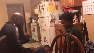 Older Man Play Boxing With Kids From A Chair Falls When The Chair Breaks