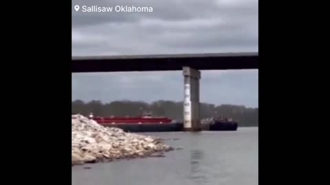 A large barge crashed into the Arkansas River bridge