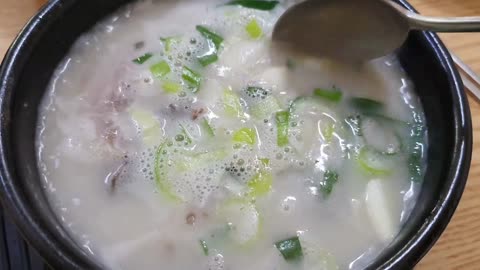 Cooked rice in soup of stuffed intestine