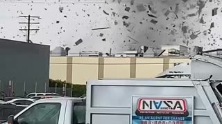 Tornado Blows Through Buildings